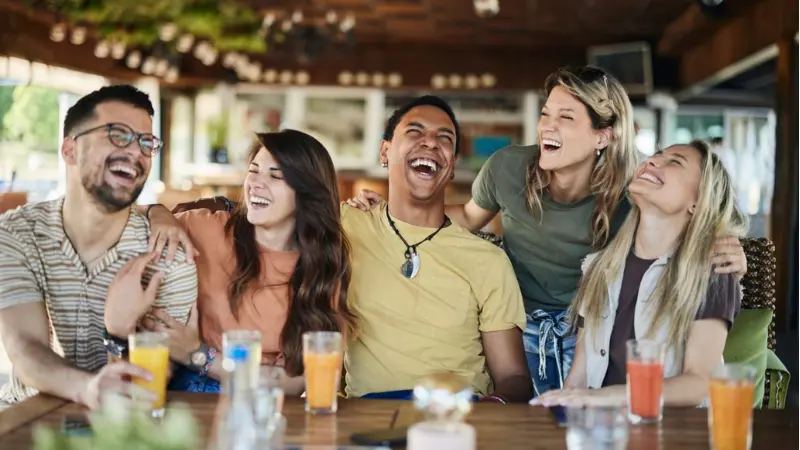 Friends sitting together and smiling in a casual group photo